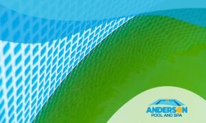 Close-up shot of green water in a tiled pool.